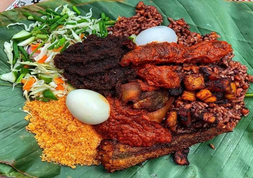 Mouthwatering Waakye, a northern Ghana dish with fish, eggs, meat and vegetables